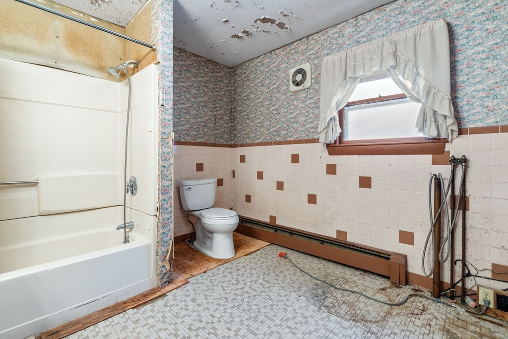 169 Nashua Road Pepperell, MA 01463 - Photo 12 of 31 a bathroom with a toilet and a shower