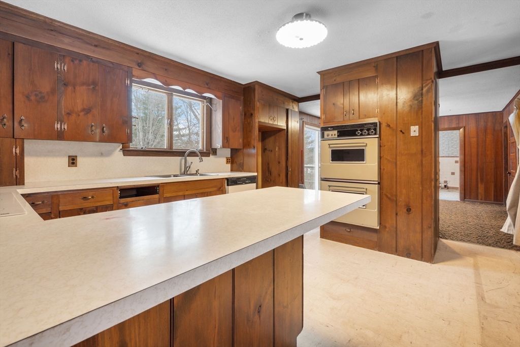 169 Nashua Road Pepperell, MA 01463 - Photo 13 of 31 a large kitchen with stainless steel appliances a large counter top