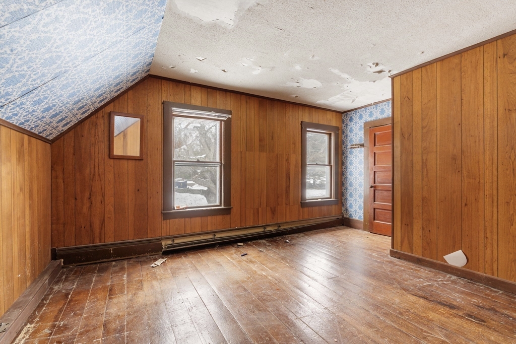 169 Nashua Road Pepperell, MA 01463 - Photo 21 of 31 a view of an empty room with wooden floor and a window