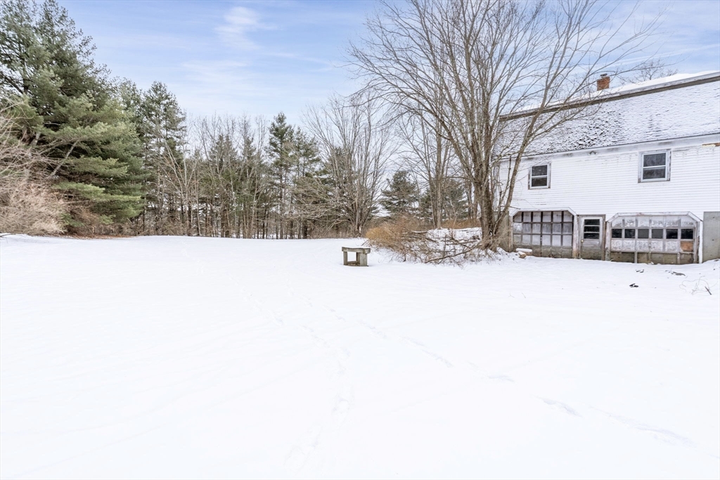 169 Nashua Road Pepperell, MA 01463 - Photo 29 of 31 a street view covered with snow