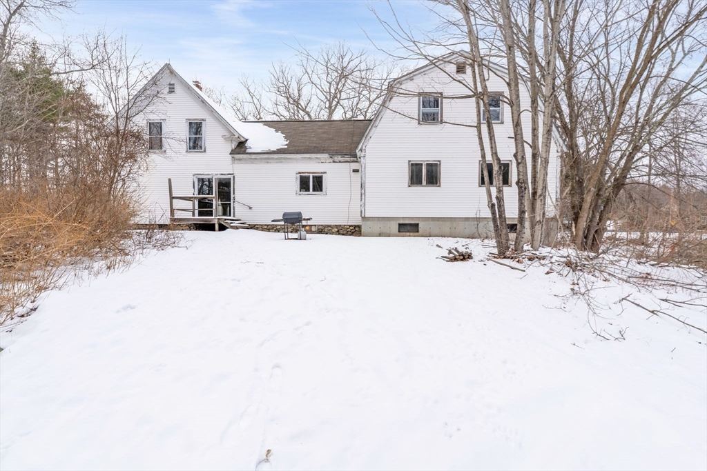 169 Nashua Road Pepperell, MA 01463 - Photo 30 of 31 a view of a white house with a snow on the road