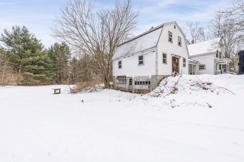 169 Nashua Road Pepperell, MA 01463 - Photo 4 of 31 a view of white house with a snow