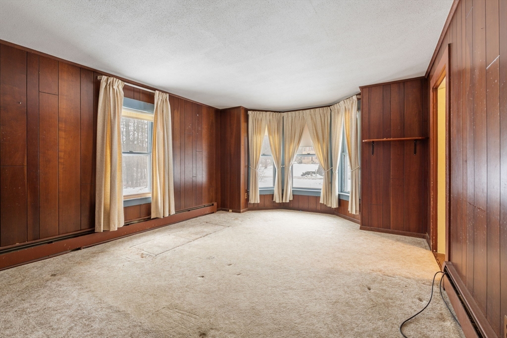 169 Nashua Road Pepperell, MA 01463 - Photo 5 of 31 an empty room with windows and closet