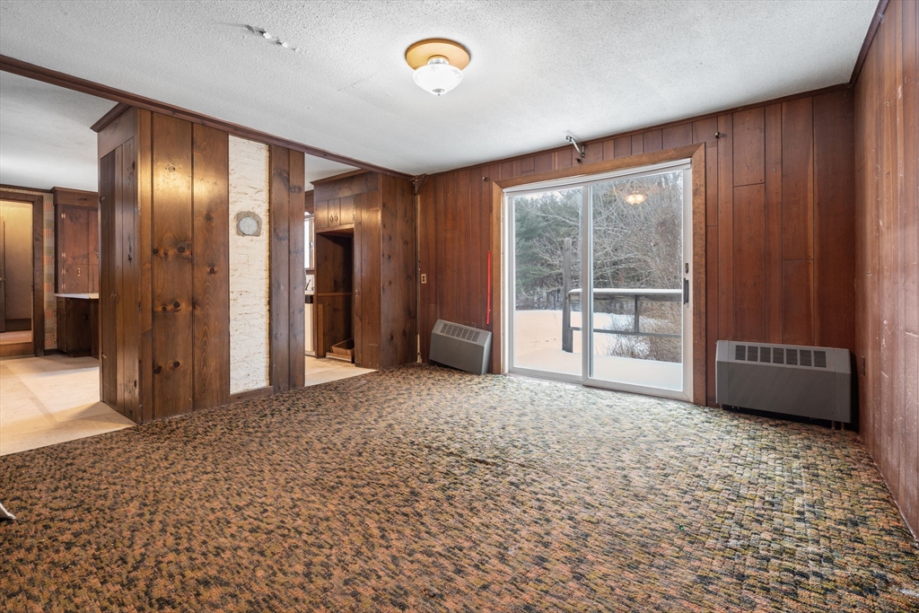 169 Nashua Road Pepperell, MA 01463 - Photo 10 of 31 an empty room with entrance and windows