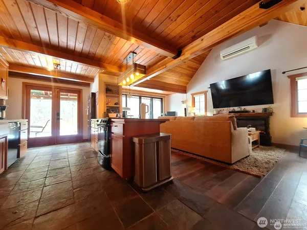 a view of a livingroom with furniture and a flat screen tv