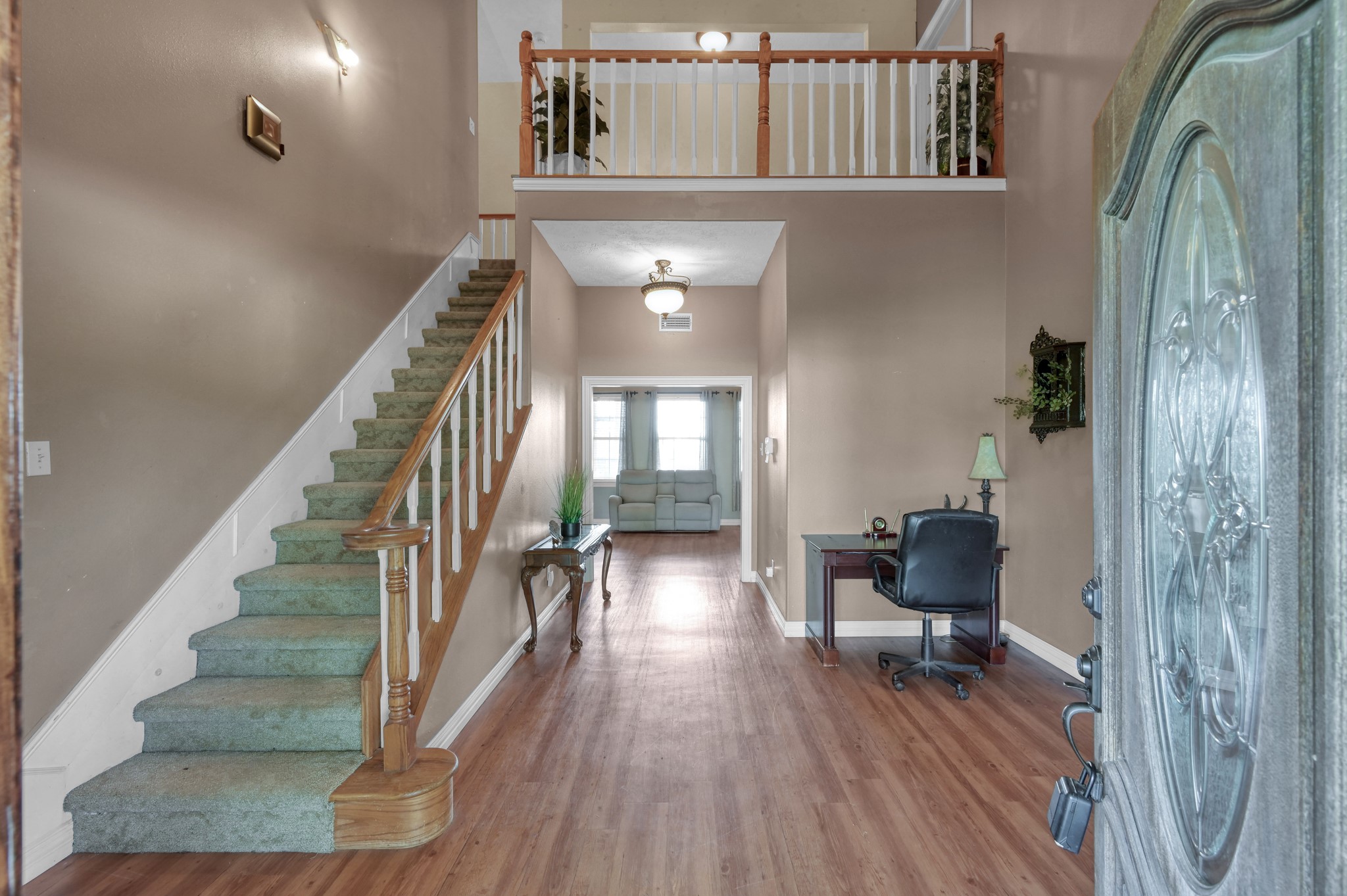 144 Wood Farm Road Huntsville, TX 77320 - Photo 5 of 35 a view of staircase with wooden floor and furniture