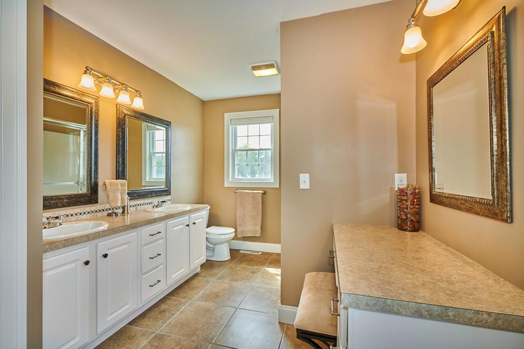 119 White Loaf Road Southampton, MA 01073 - Photo 20 of 41 a spacious bathroom with a granite countertop sink and a mirror
