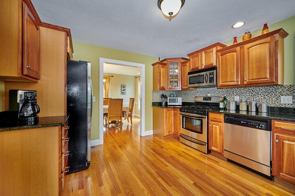 119 White Loaf Road Southampton, MA 01073 - Photo 8 of 41 a kitchen with stainless steel appliances granite countertop a stove a sink and a refrigerator