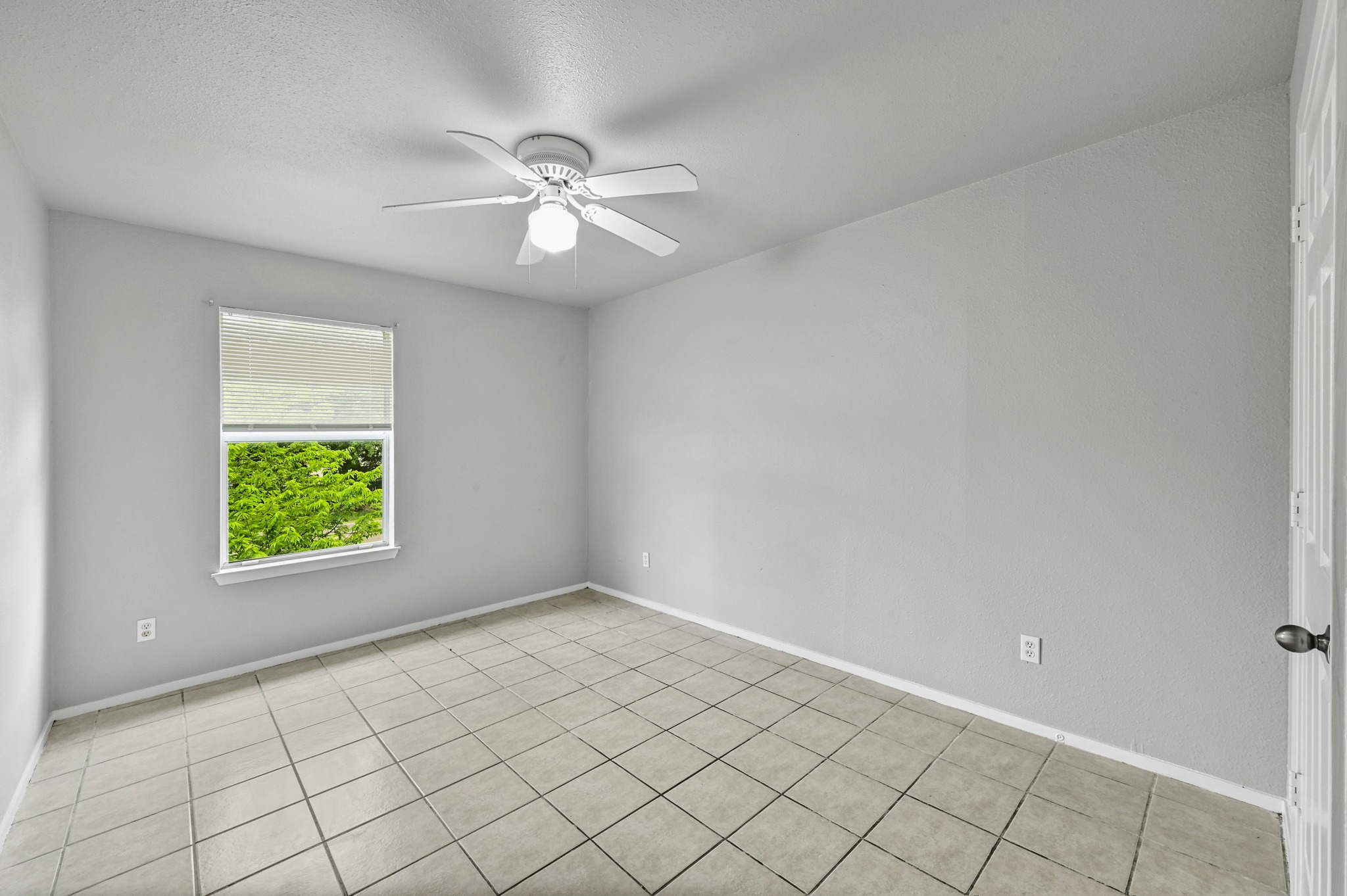 2212 Katy Lane Georgetown, TX 78626 - Photo 22 of 27 This room features light-colored tiled flooring and a ceiling fan with integrated lighting
