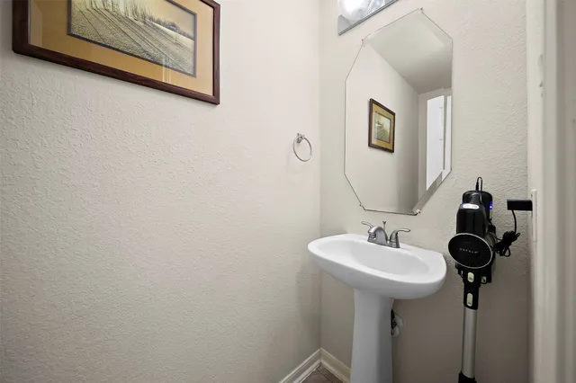 a bathroom with a sink and mirror