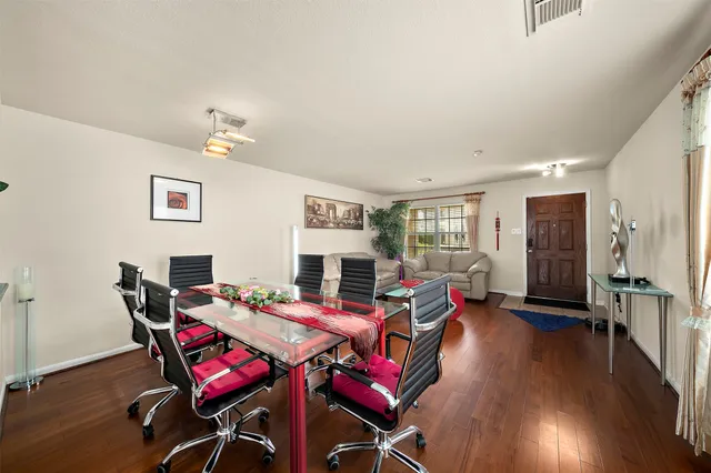 a view of a dining room with furniture window and wooden floor