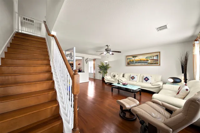 a room with furniture and wooden floor