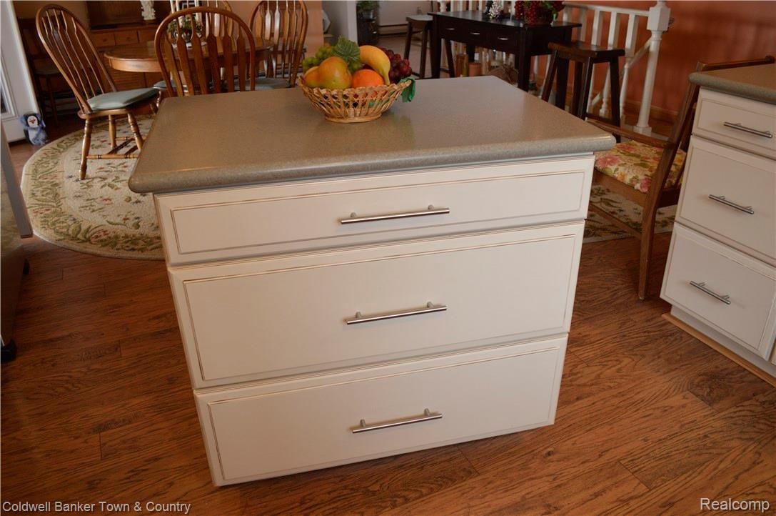 9797 Van Buren Road Fowlerville, MI 48836 - Photo 20 of 56 KITCHEN ISLAND WITH STORAGE AND ON WHEELS