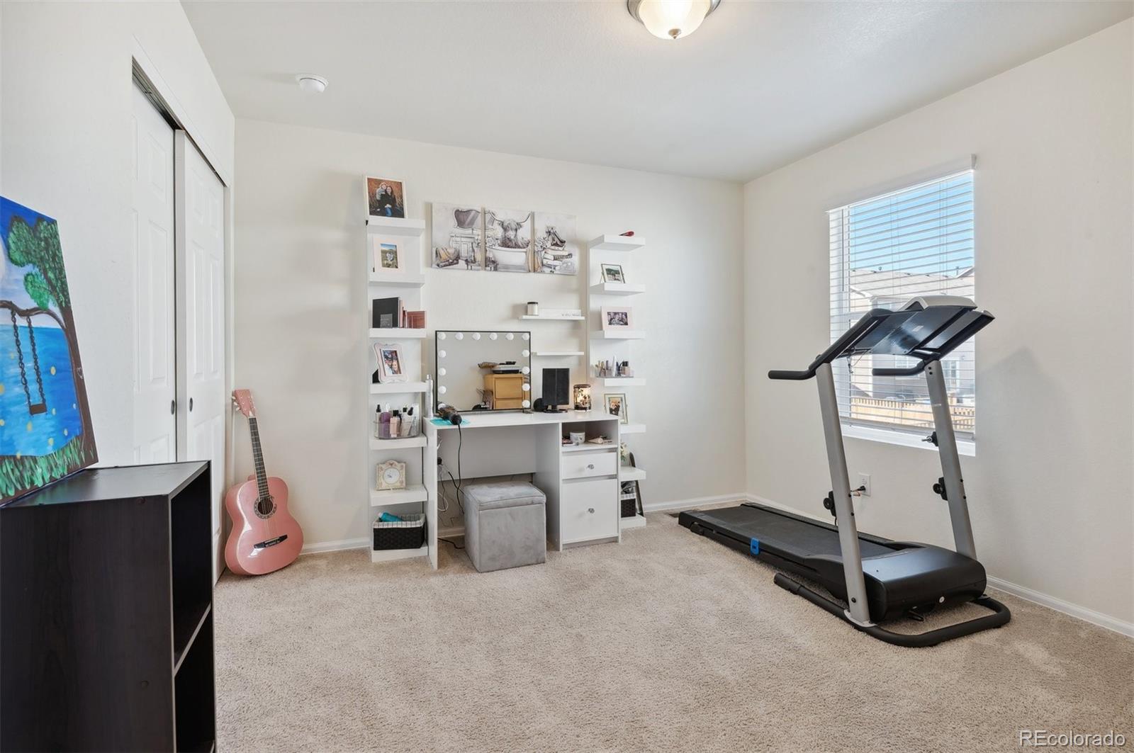 2328 Ruby Avenue Brighton, CO 80603 - Photo 19 of 21 a room with a window and gym equipment