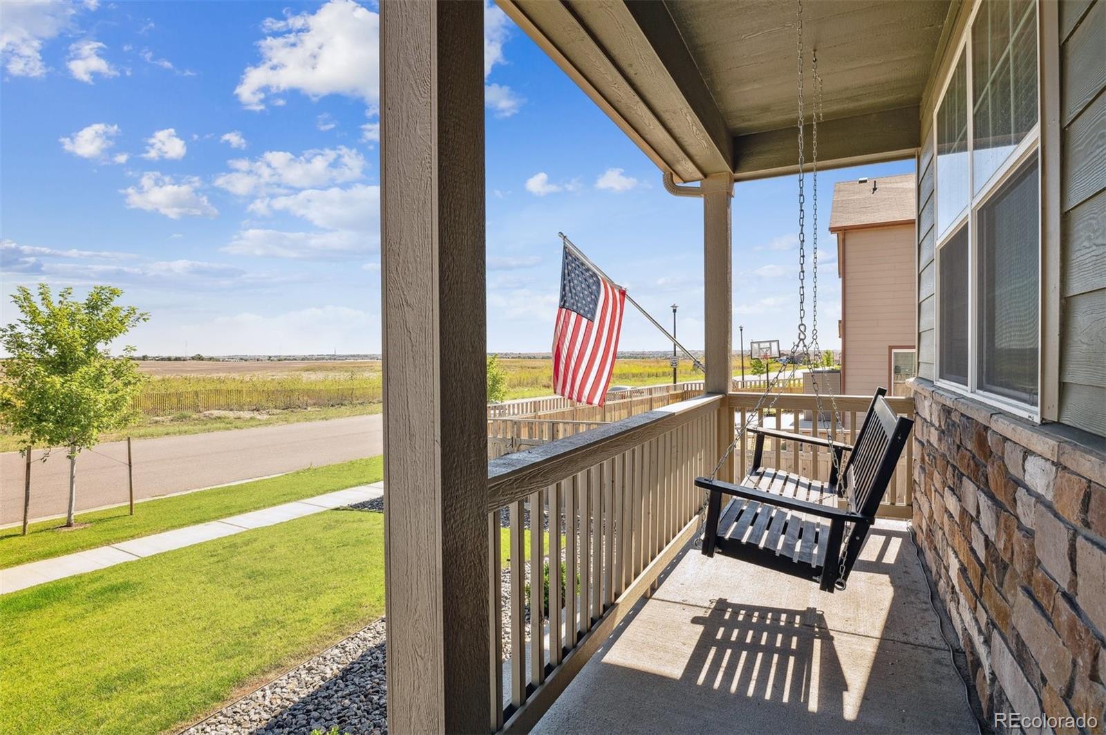 2328 Ruby Avenue Brighton, CO 80603 - Photo 2 of 21 a view of a balcony with furniture and floor to ceiling window