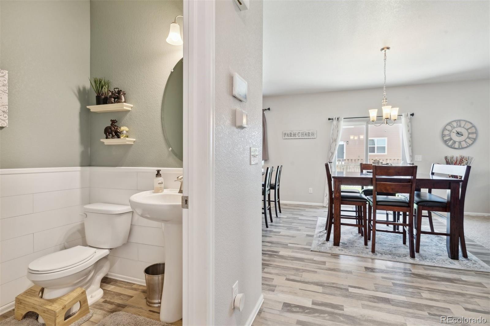 2328 Ruby Avenue Brighton, CO 80603 - Photo 5 of 21 a view of a dining room with furniture and chandelier
