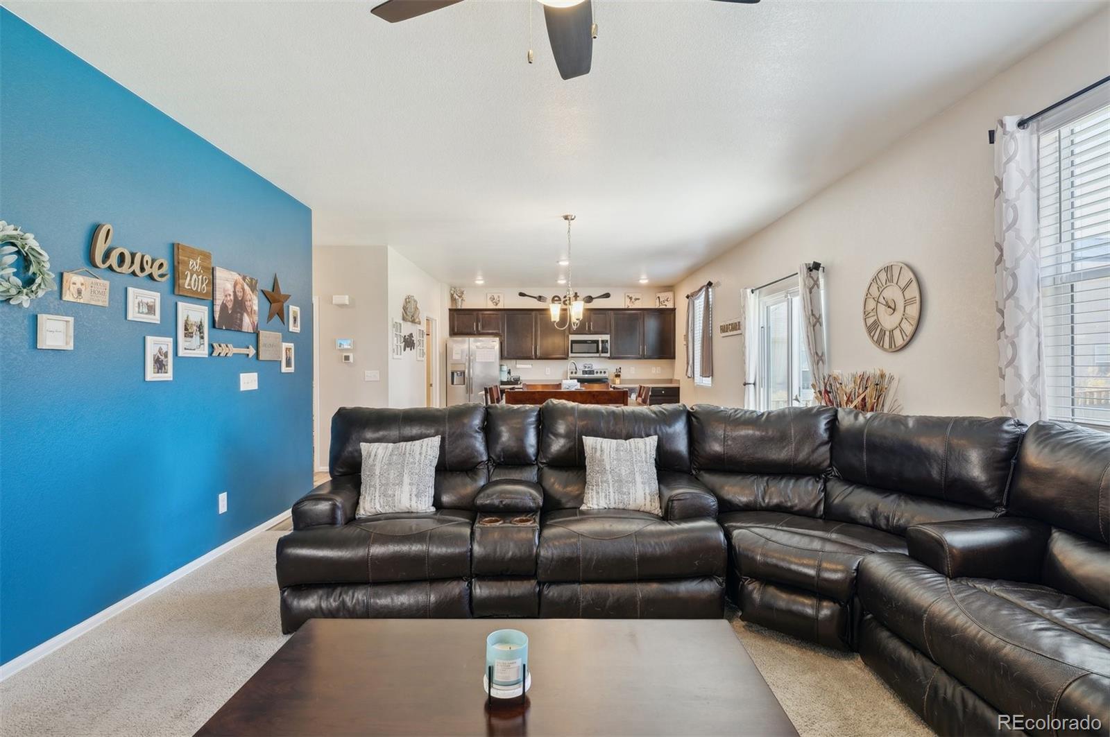 2328 Ruby Avenue Brighton, CO 80603 - Photo 10 of 21 a living room with furniture and kitchen view