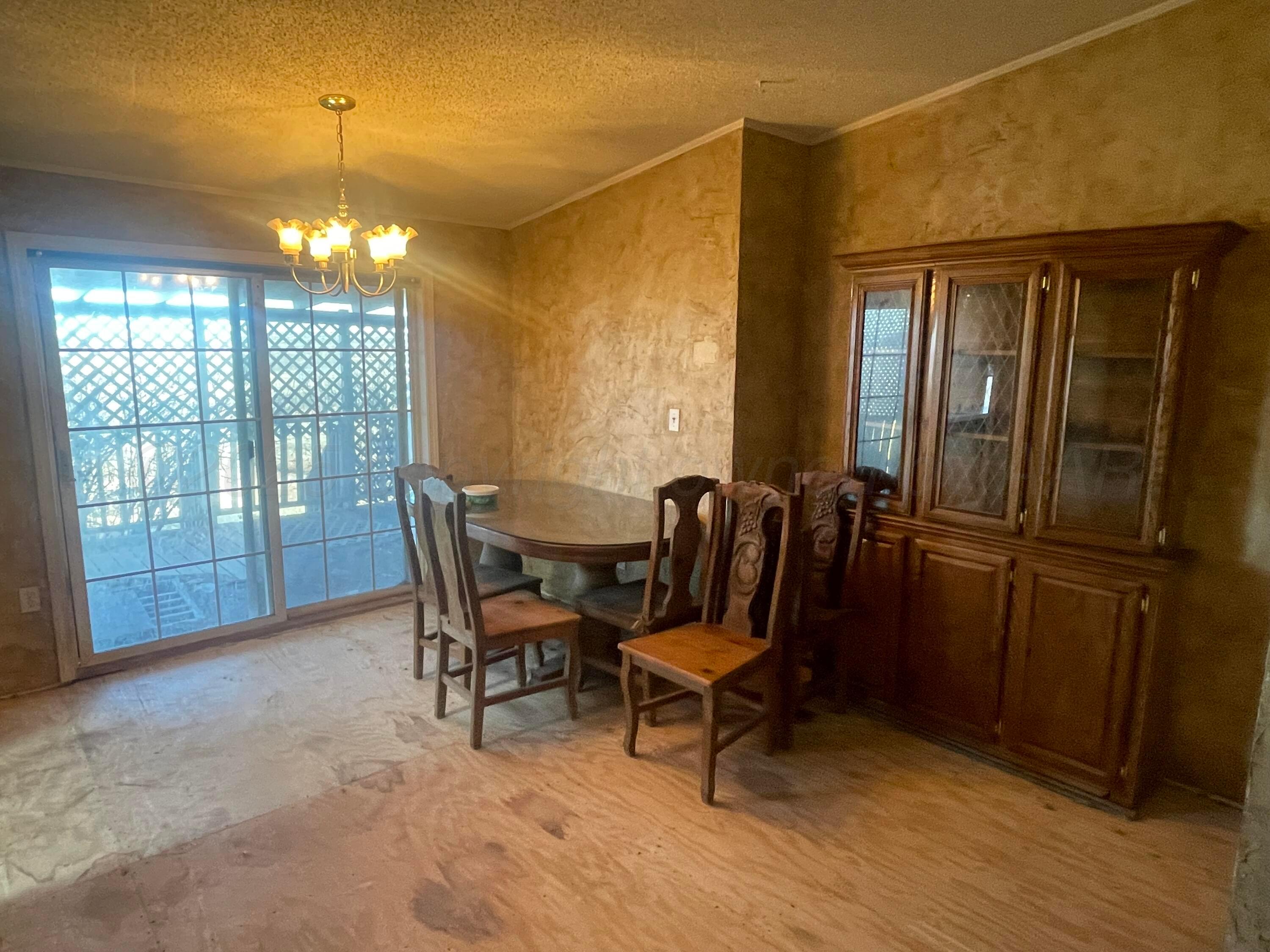 5100 Wagon Wheel Road Amarillo, TX 79124 - Photo 23 of 54 a view of a livingroom with furniture window and wooden floor