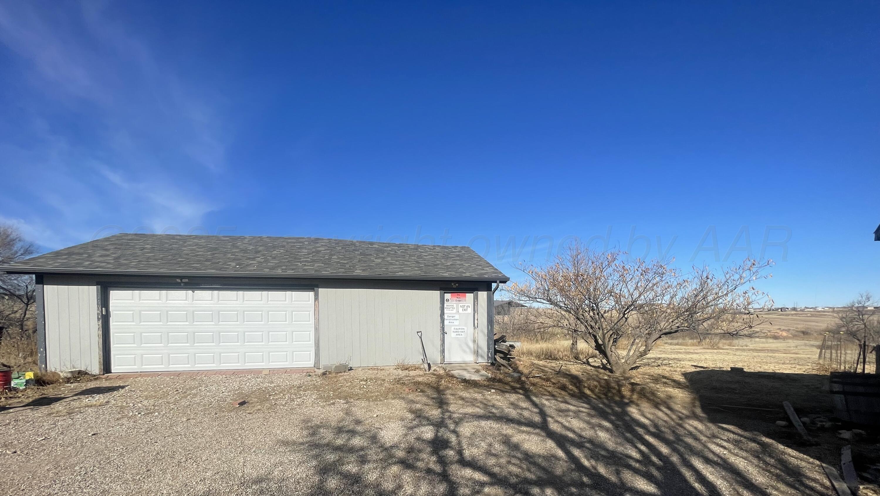 5100 Wagon Wheel Road Amarillo, TX 79124 - Photo 3 of 54 a front view of a house with a yard