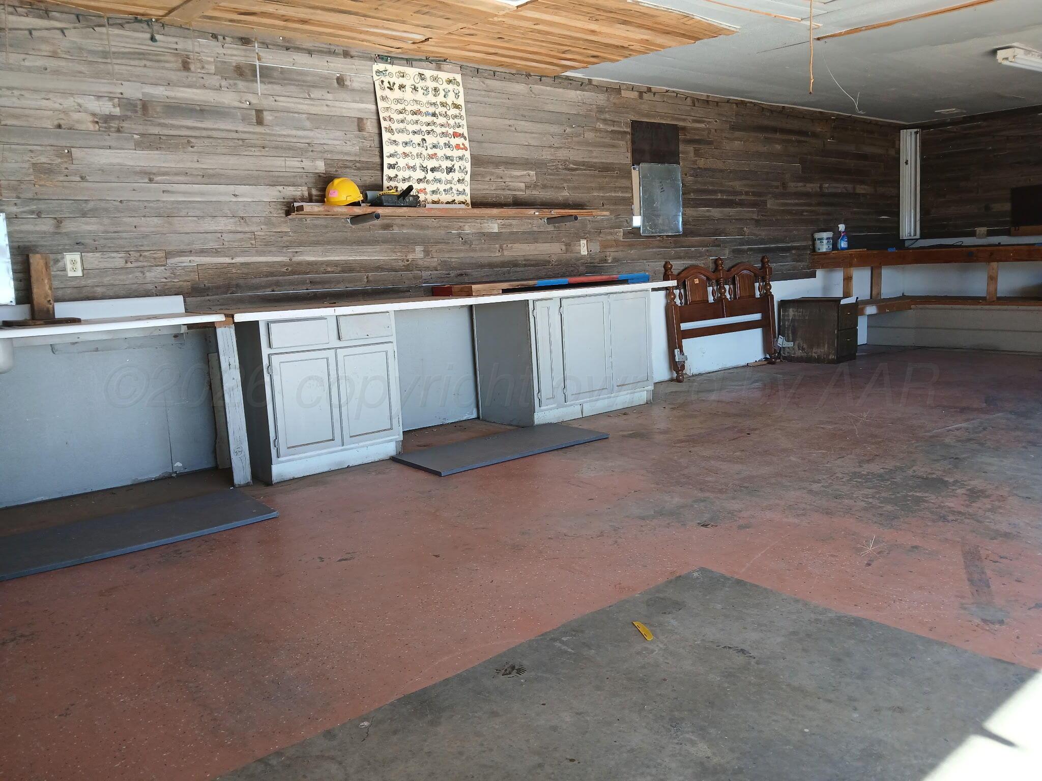 5100 Wagon Wheel Road Amarillo, TX 79124 - Photo 6 of 54 a kitchen with stainless steel appliances a sink stove and cabinets