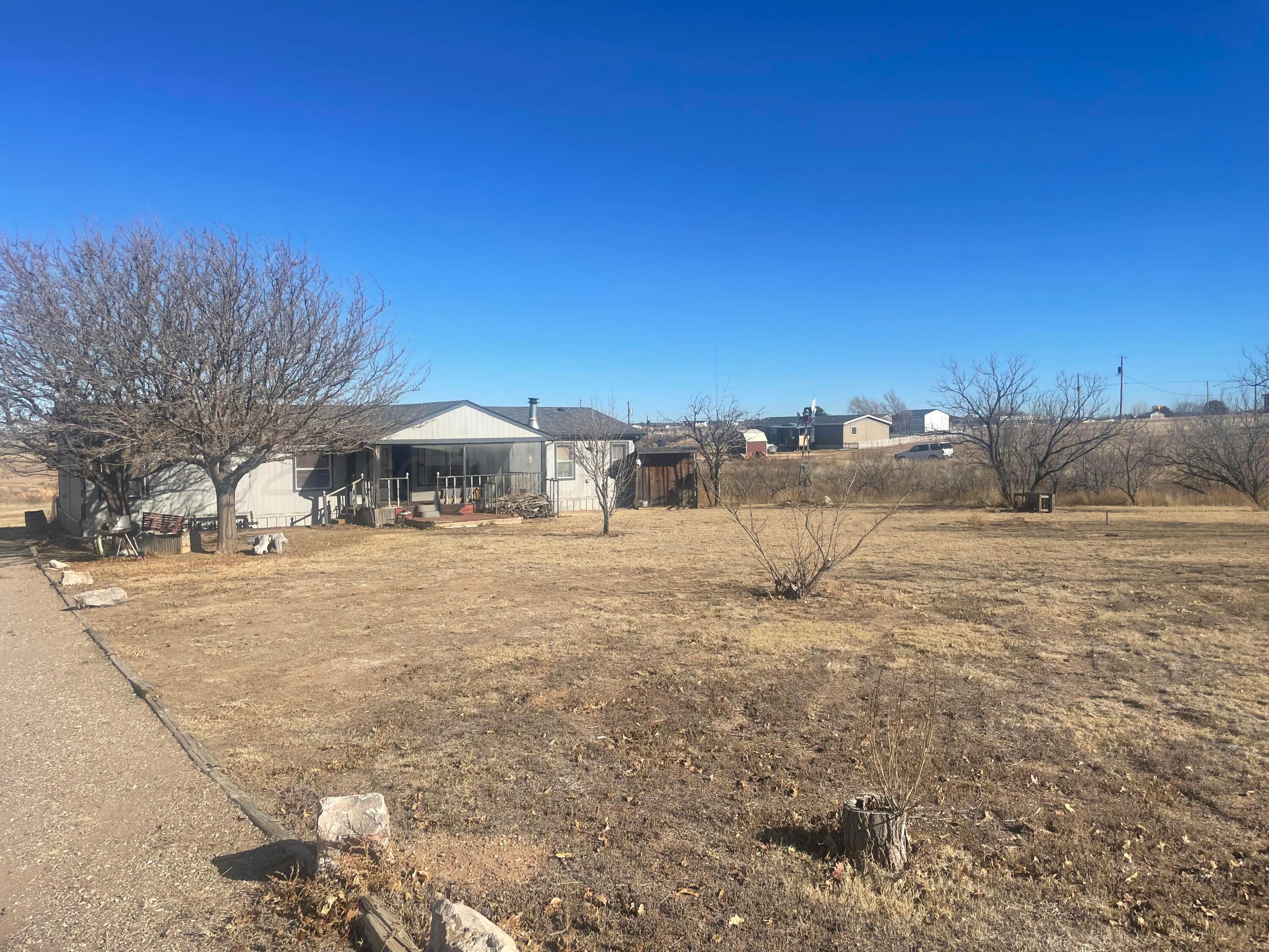 5100 Wagon Wheel Road Amarillo, TX 79124 - Photo 8 of 54 a view of a yard with a house