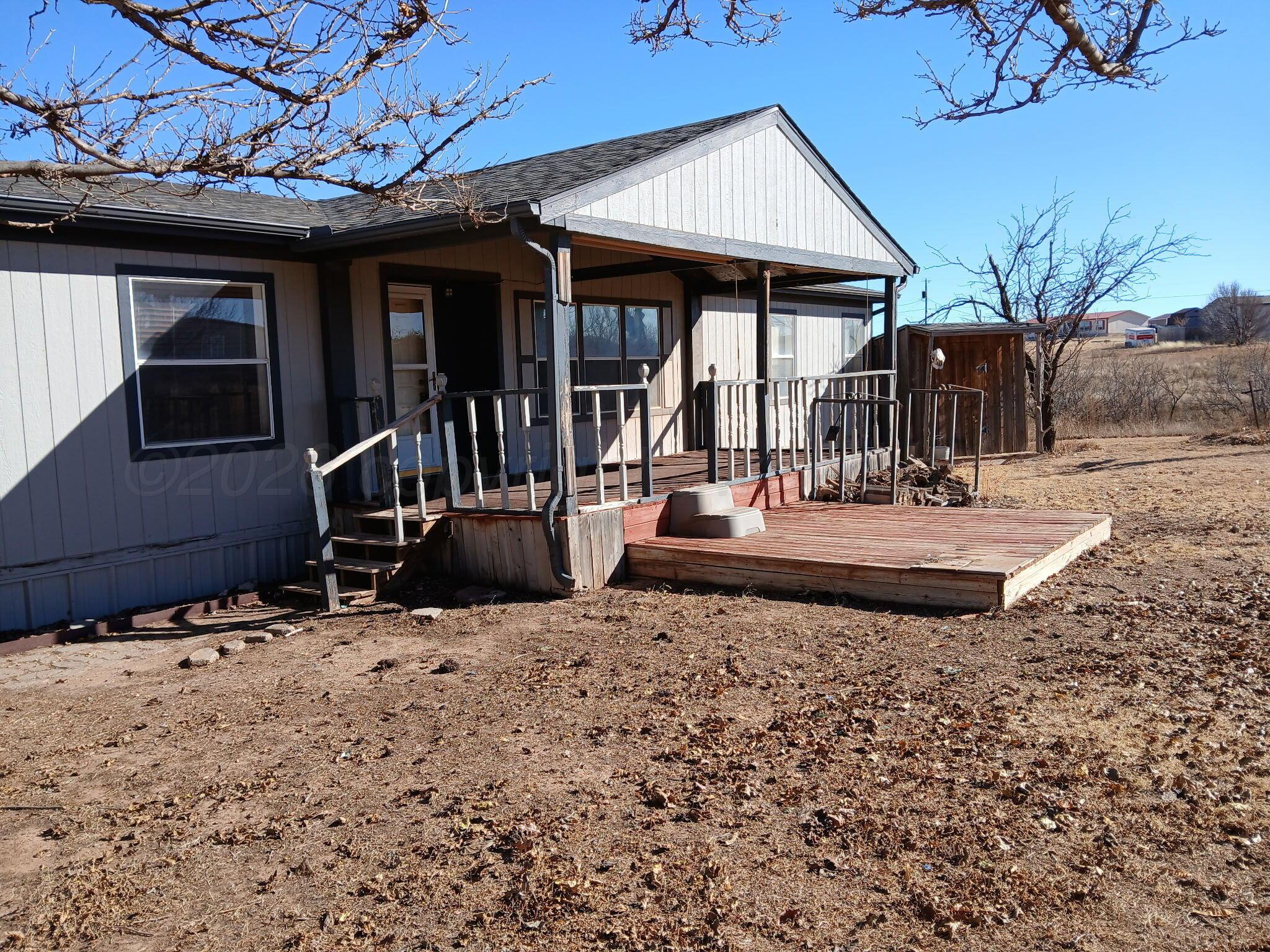 5100 Wagon Wheel Road Amarillo, TX 79124 - Photo 10 of 54 a view of a house with backyard and sitting area