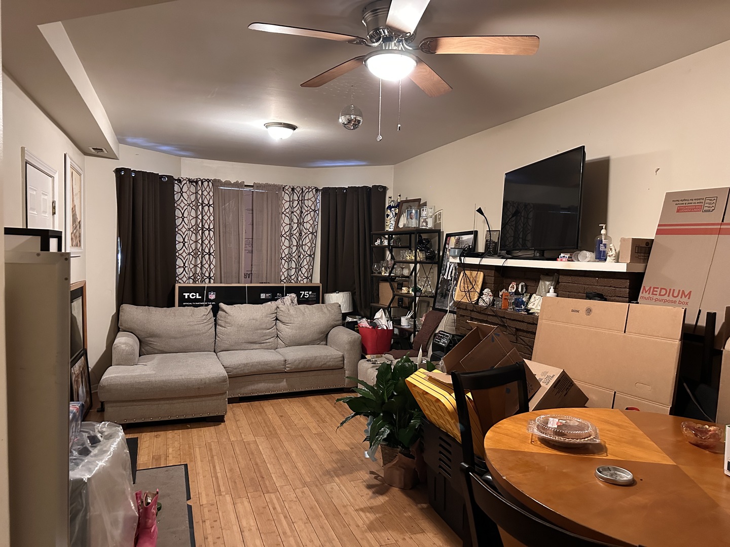 1842 South Drake Avenue Chicago, IL 60623 - Photo 16 of 47 a living room with furniture and a flat screen tv