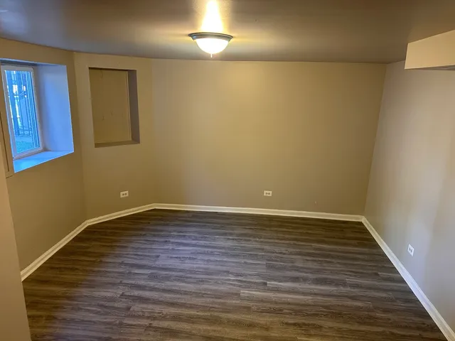 a kitchen with granite countertop a stove and a refrigerator