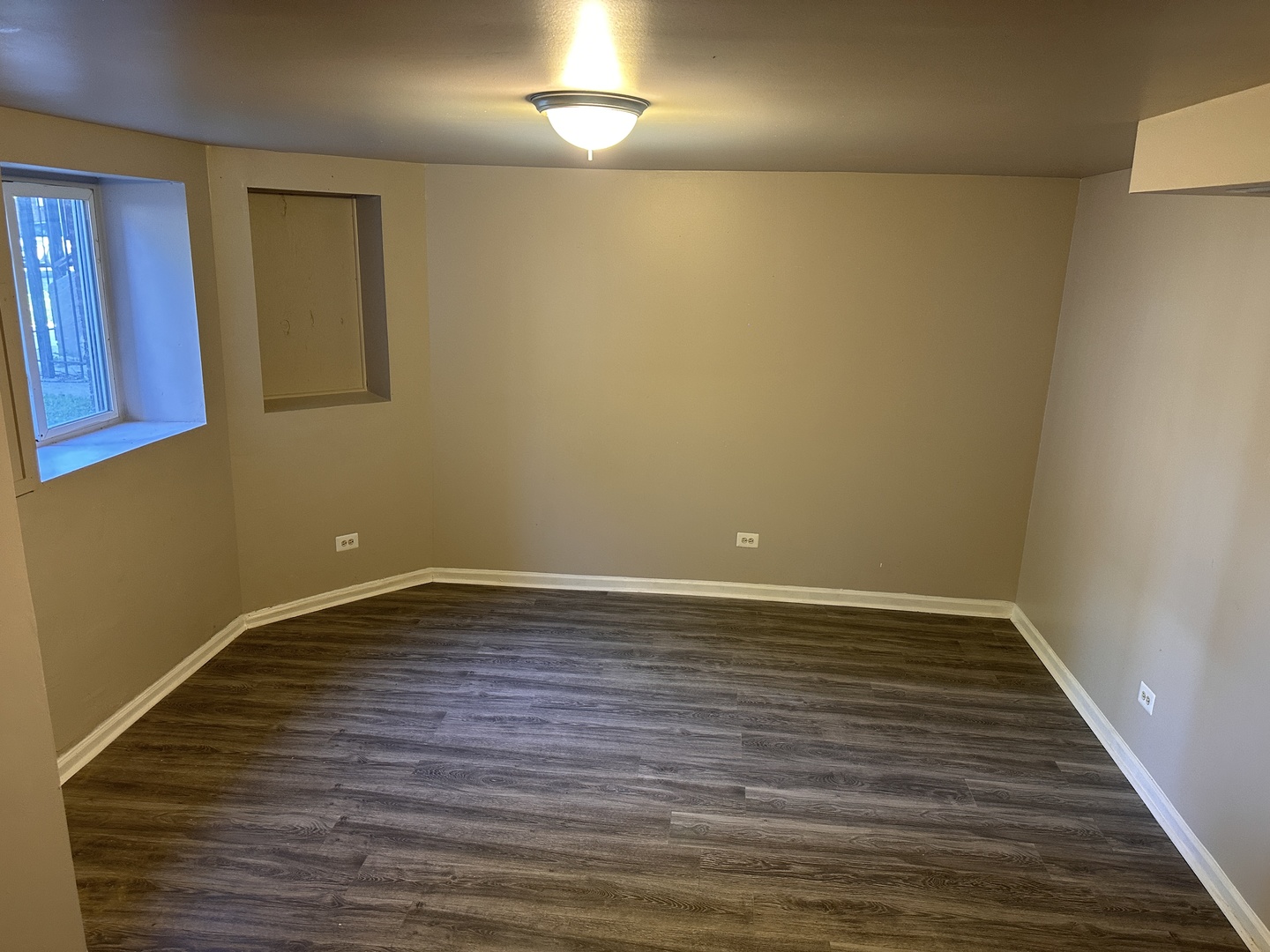 1842 South Drake Avenue Chicago, IL 60623 - Photo 21 of 47 a view of an empty room with wooden floor