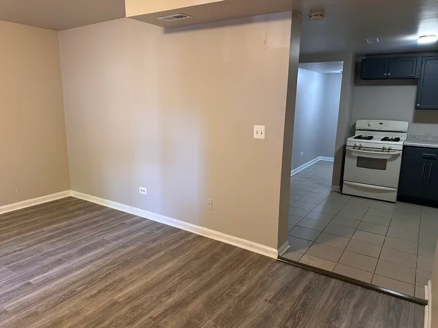 a kitchen with granite countertop cabinets and steel stainless steel appliances
