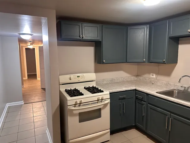 a white toilet sitting next to a shower