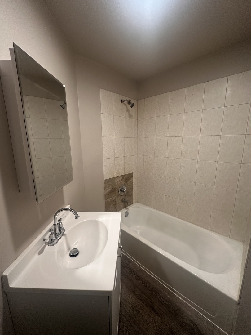 1842 South Drake Avenue Chicago, IL 60623 - Photo 27 of 47 a bathroom with a sink and a bathtub
