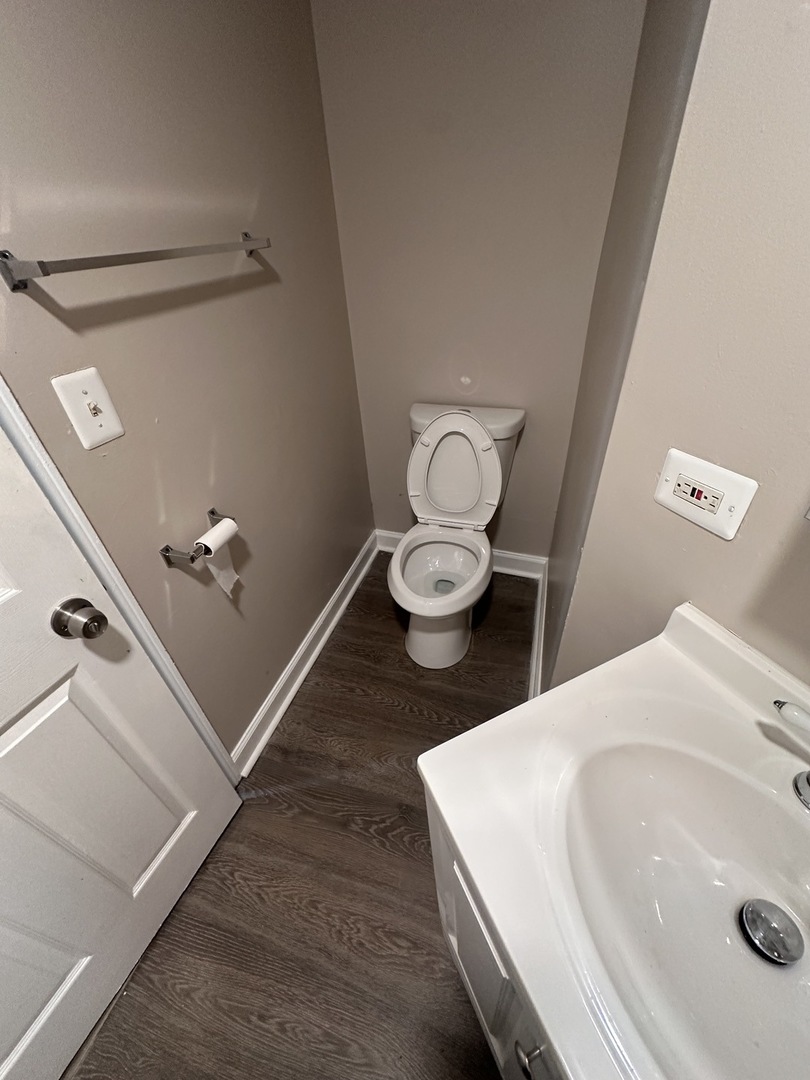 1842 South Drake Avenue Chicago, IL 60623 - Photo 28 of 47 a bathroom with a sink and a toilet