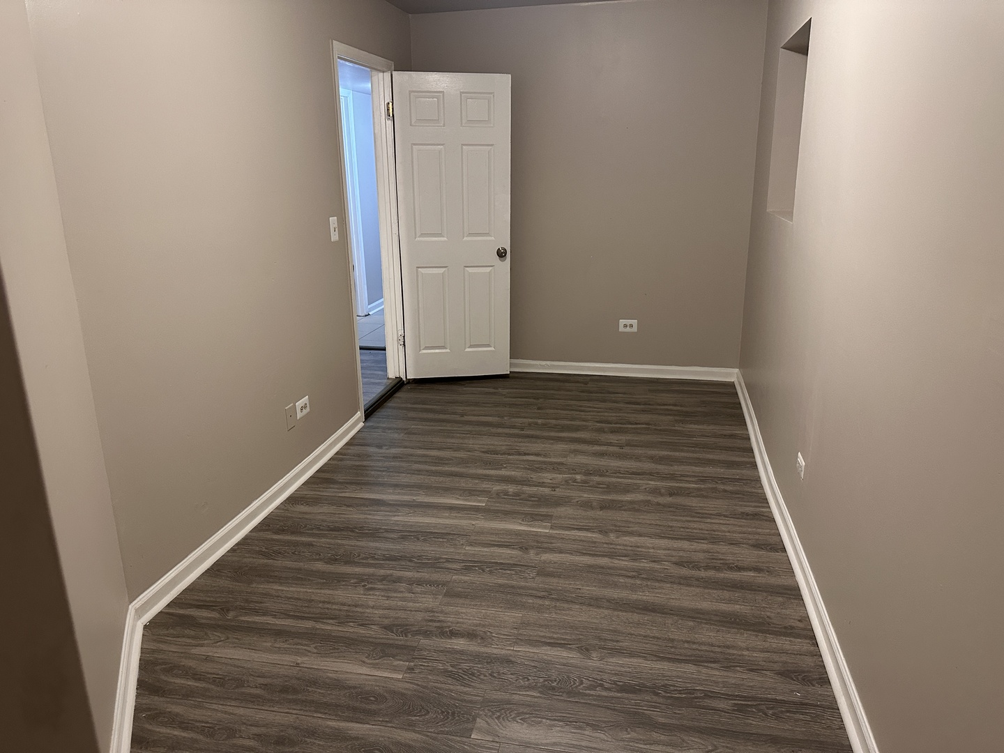 1842 South Drake Avenue Chicago, IL 60623 - Photo 31 of 47 a view of a hallway with wooden floor