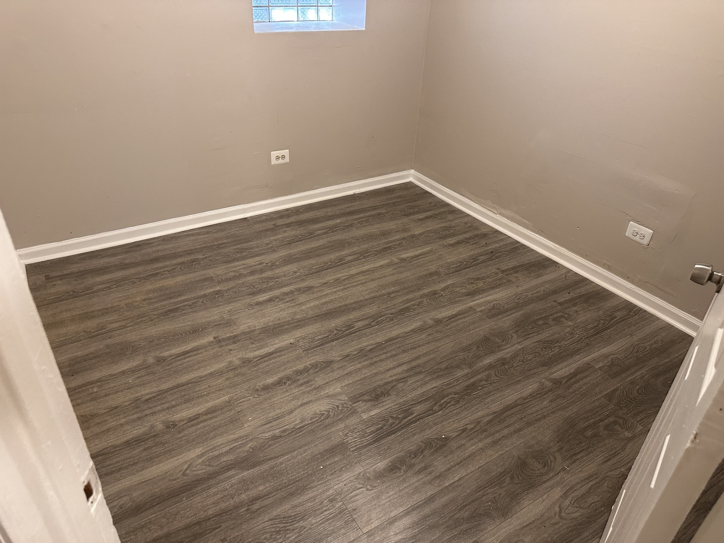 1842 South Drake Avenue Chicago, IL 60623 - Photo 32 of 47 a view of an empty room with wooden floor