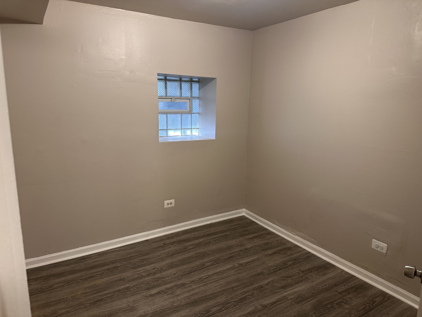 1842 South Drake Avenue Chicago, IL 60623 - Photo 33 of 47 a view of a room with wooden floor and windows