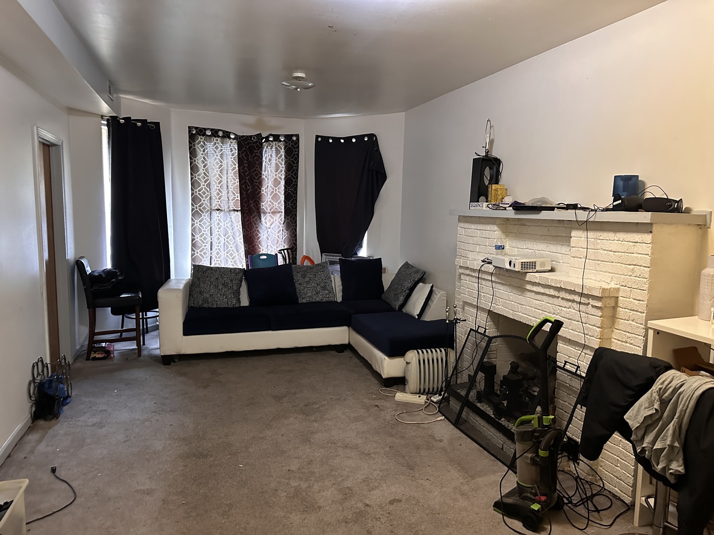 1842 South Drake Avenue Chicago, IL 60623 - Photo 5 of 47 a living room with furniture ceiling fan and a window