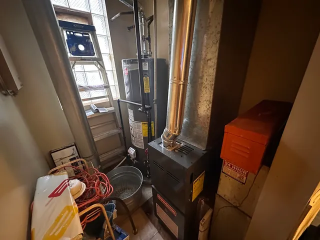 a view of walk in closet with clothes