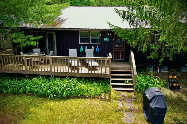 a view of a wooden deck with a yard