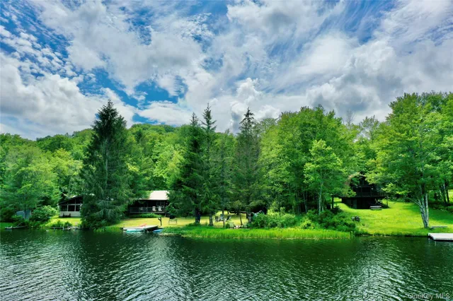 a view of a lake with a yard