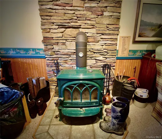 a view of a balcony with chairs and wooden floor