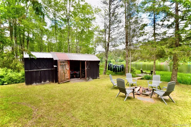 a view of a house with backyard porch and sitting area