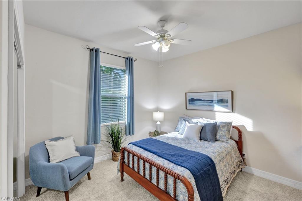 7830 Twin Eagle Lane Fort Myers, FL 33912 - Photo 21 of 31 a bedroom with bed and a couch