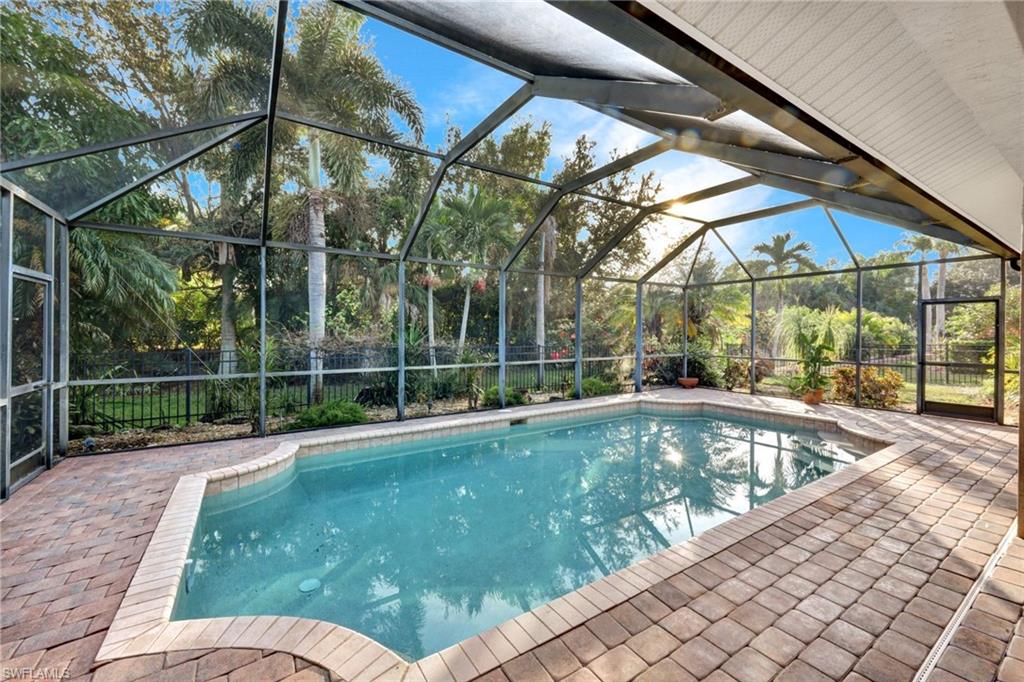 7830 Twin Eagle Lane Fort Myers, FL 33912 - Photo 27 of 31 a view of a backyard with a swimming pool