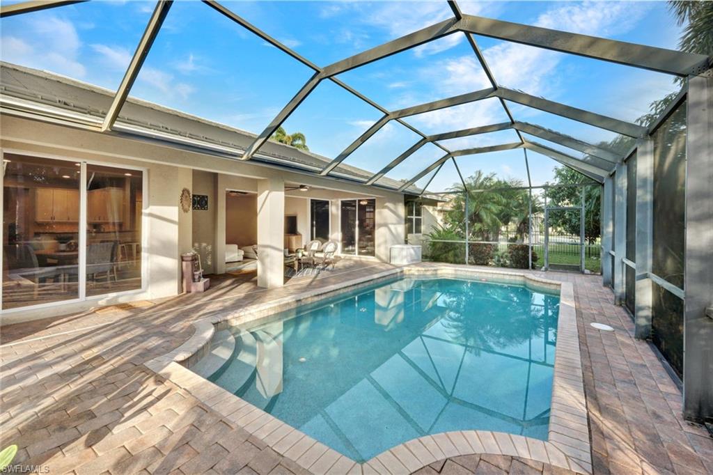 7830 Twin Eagle Lane Fort Myers, FL 33912 - Photo 28 of 31 a view of a patio with a table and chairs