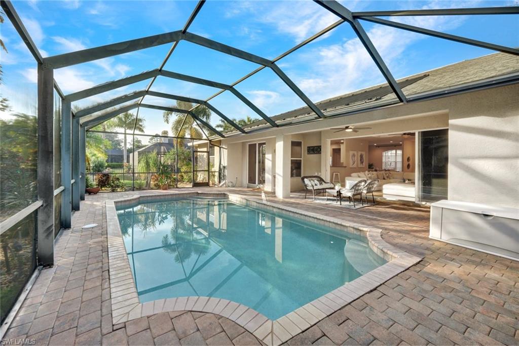 7830 Twin Eagle Lane Fort Myers, FL 33912 - Photo 29 of 31 a view of a swimming pool with a patio