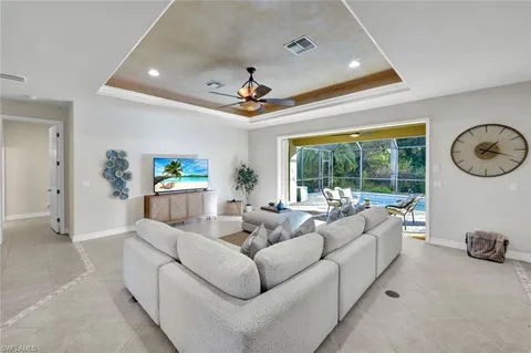 a living room with furniture white walls and white walls