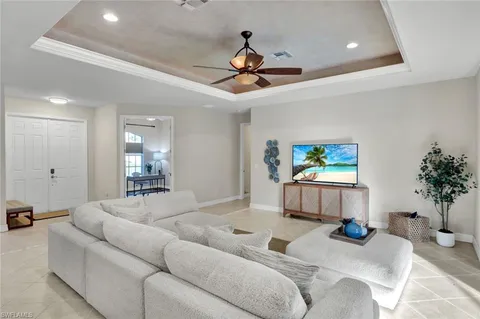 a large kitchen with kitchen island a sink table and chairs