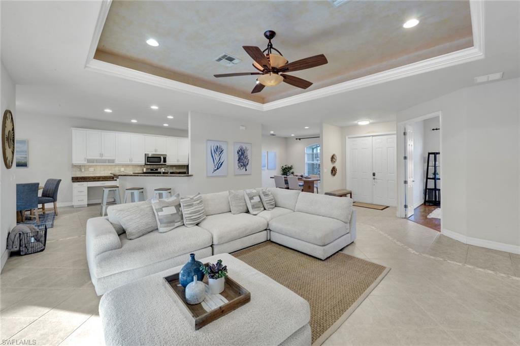 7830 Twin Eagle Lane Fort Myers, FL 33912 - Photo 9 of 31 a living room with furniture white walls and white walls