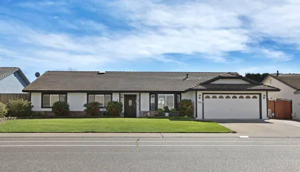 front view of a house with a garden